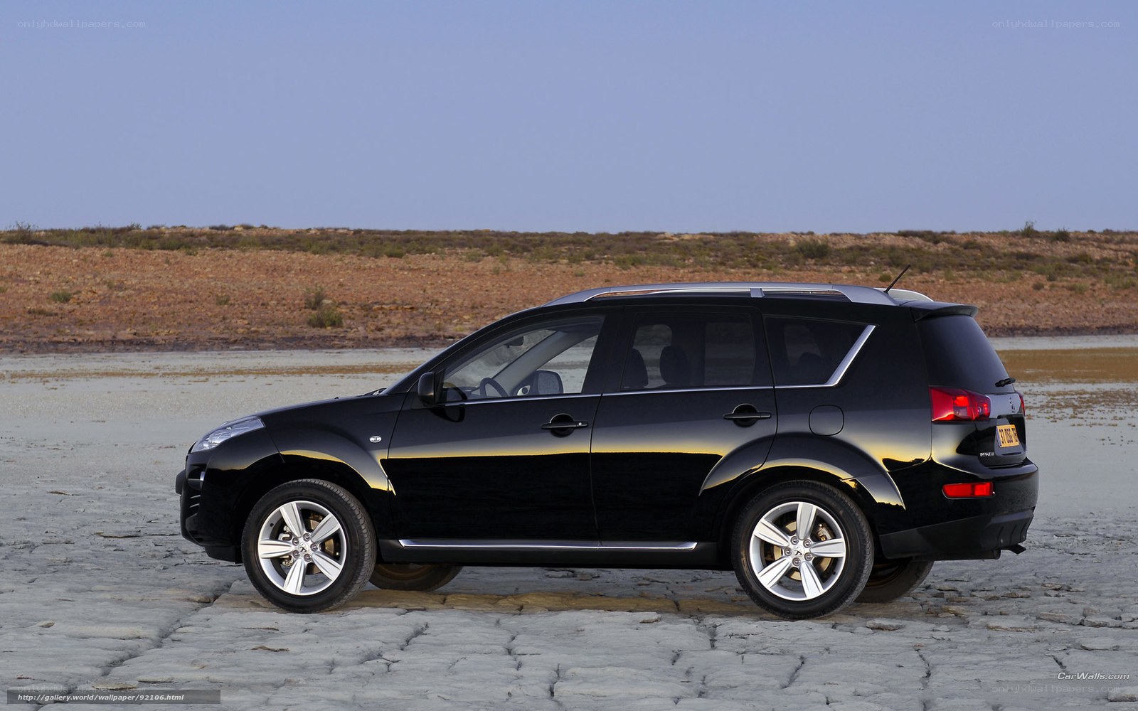 black suv on cracked ground