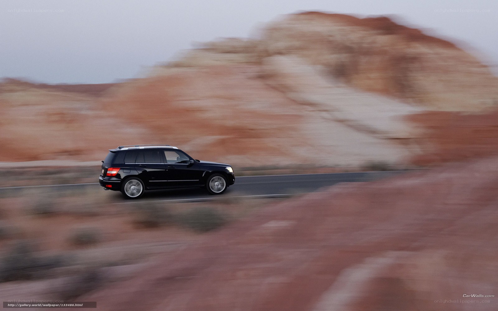 Black SUV on desert road