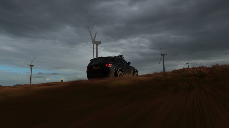 Black SUV on Dirt Road — Gray