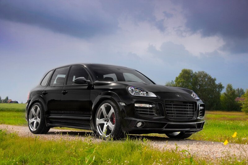 Black SUV on Gravel — Dramatic