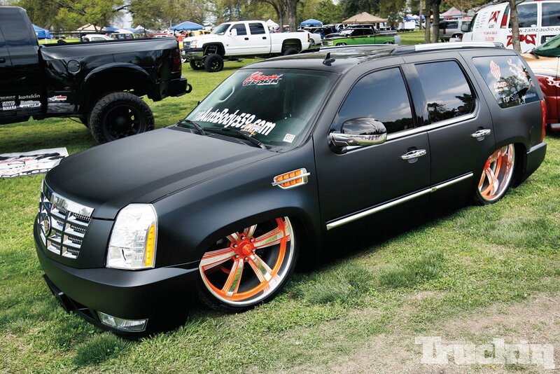 Black SUV with Orange Wheels