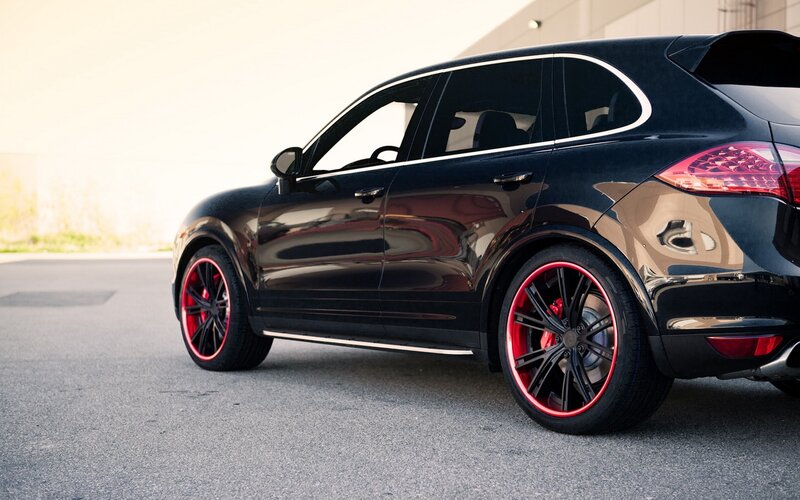 Black SUV with Red Rims — Dramatic