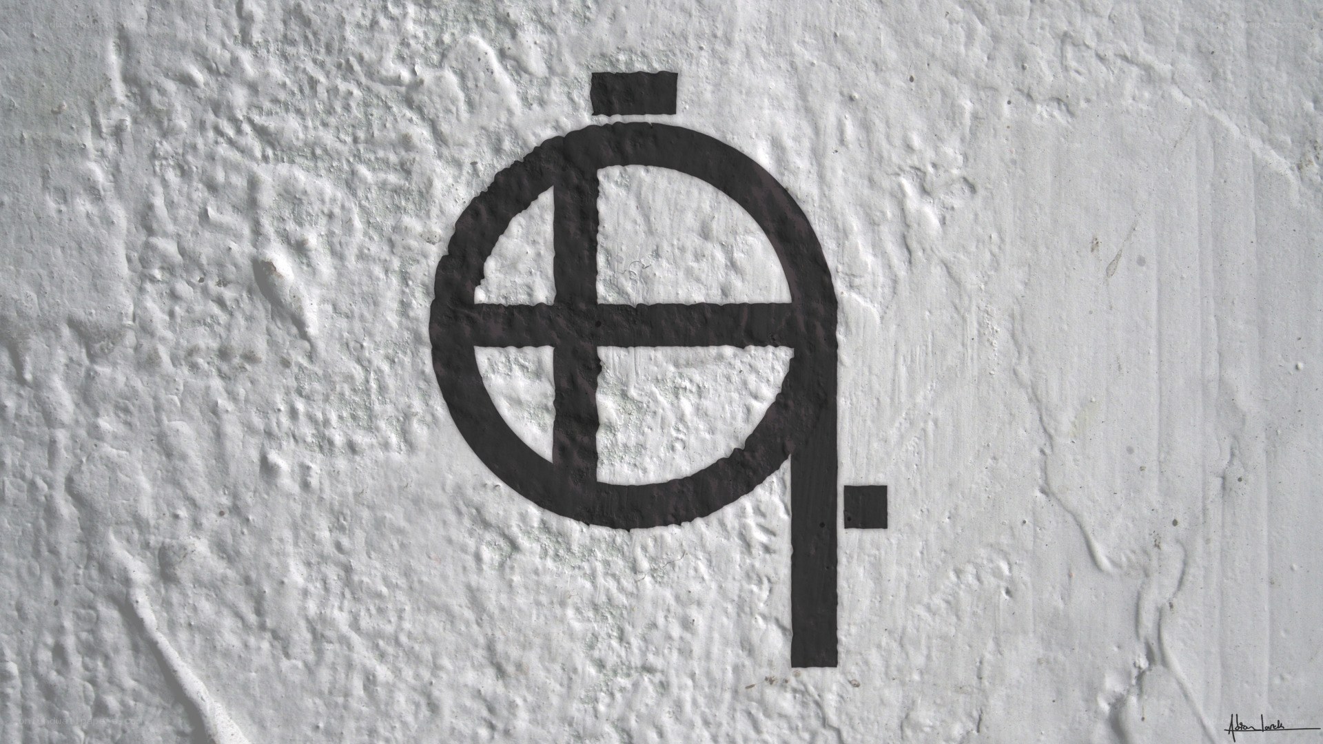 black symbol on white wall