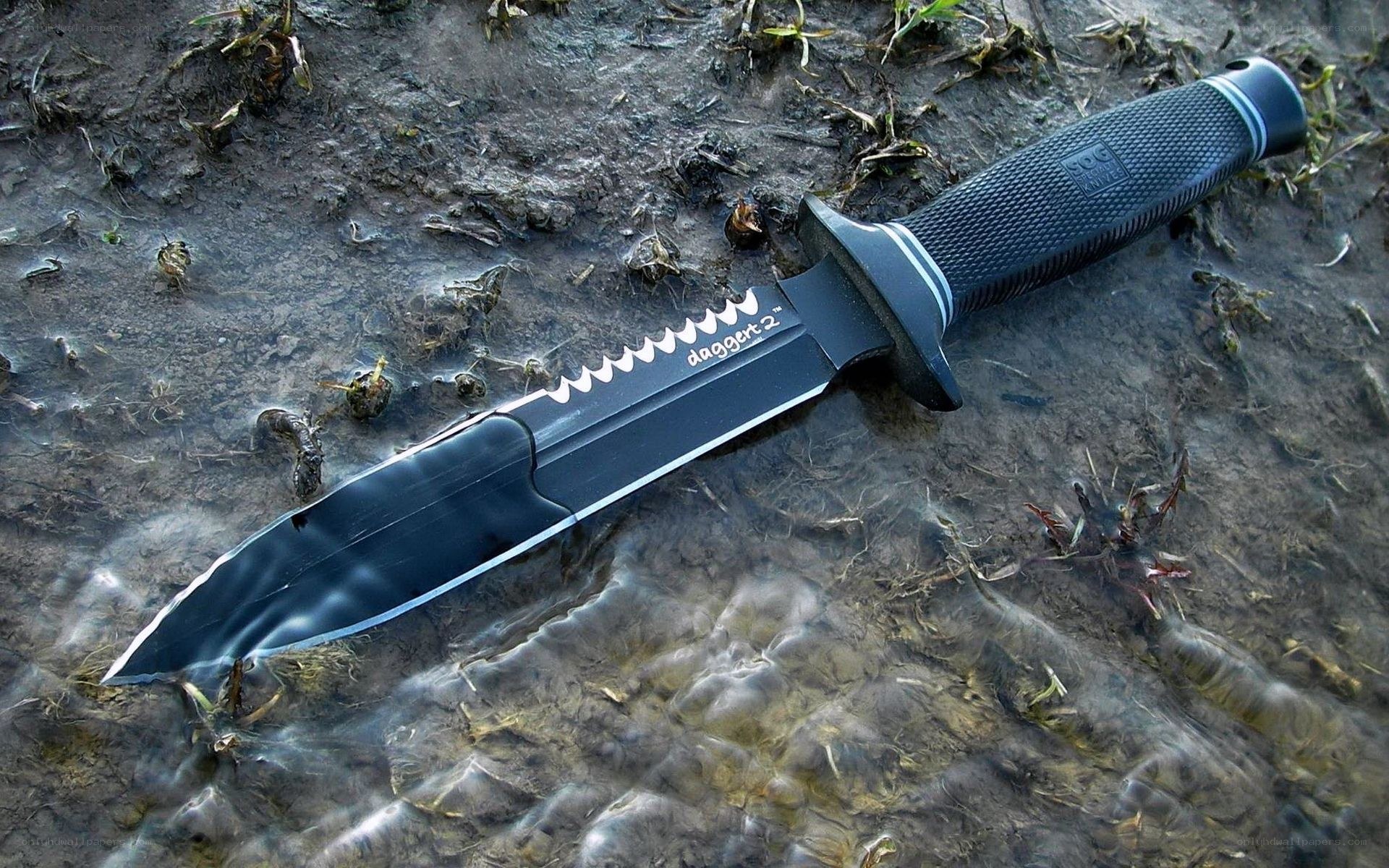 black tactical knife in water