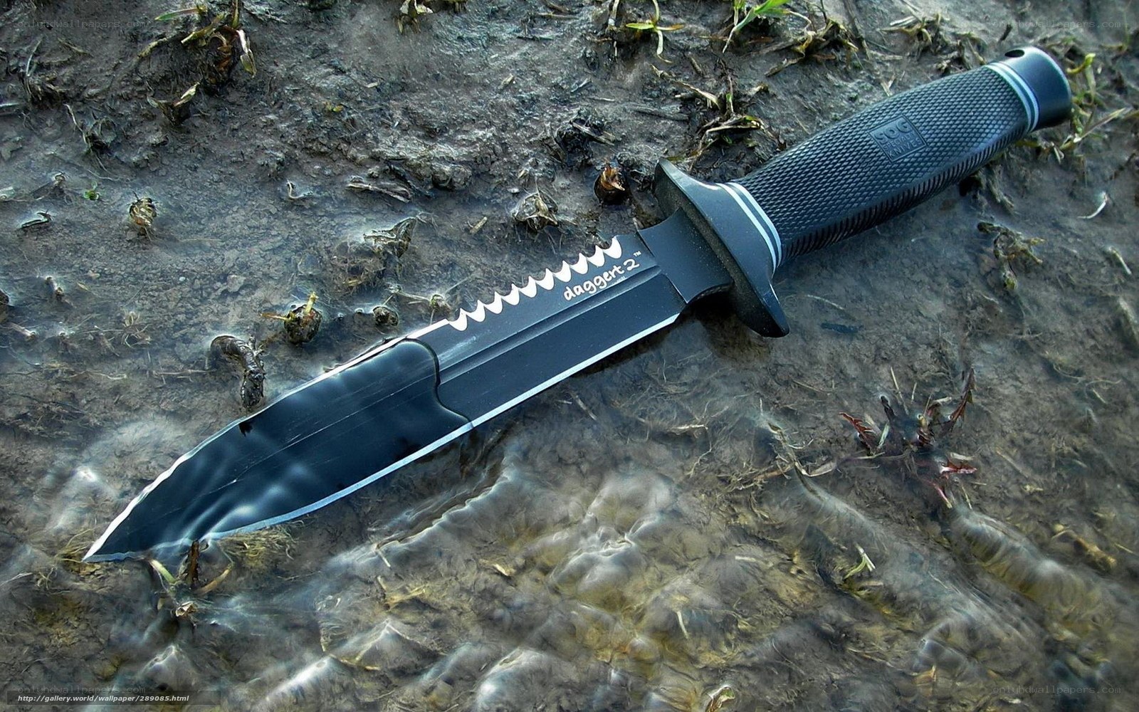black tactical knife in water