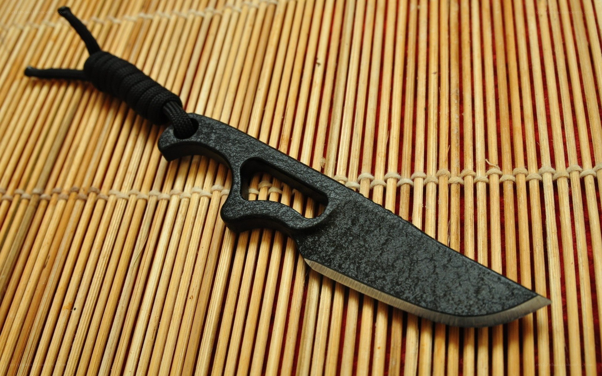 black tactical knife on mat