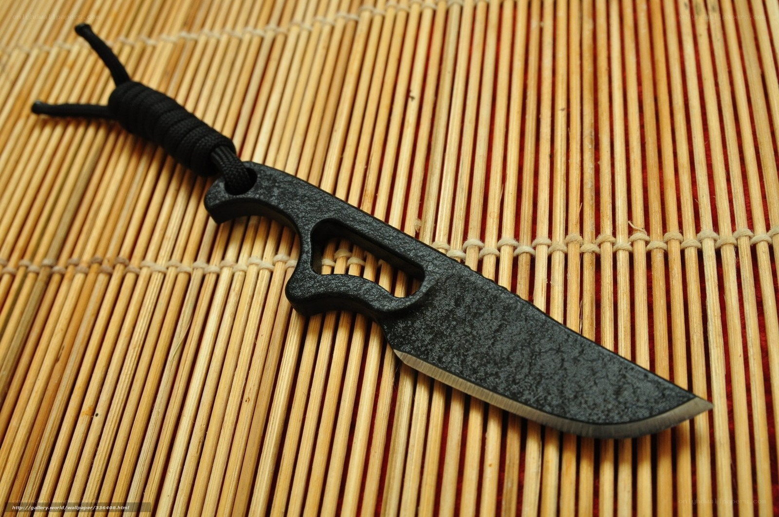 black tactical knife on mat