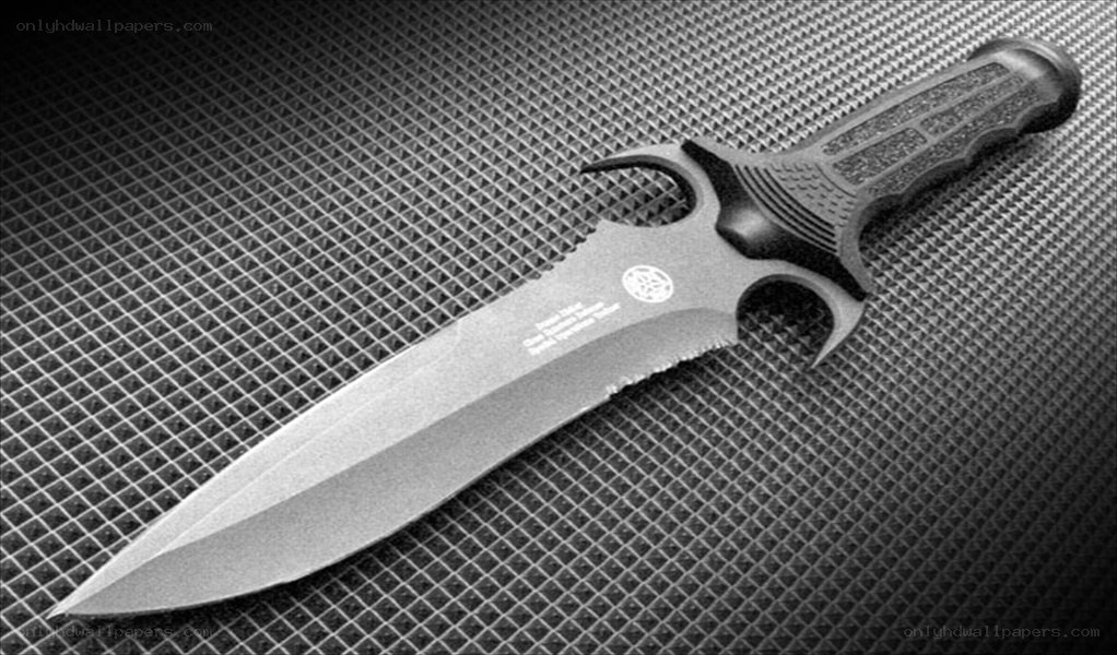 black tactical knife on mesh