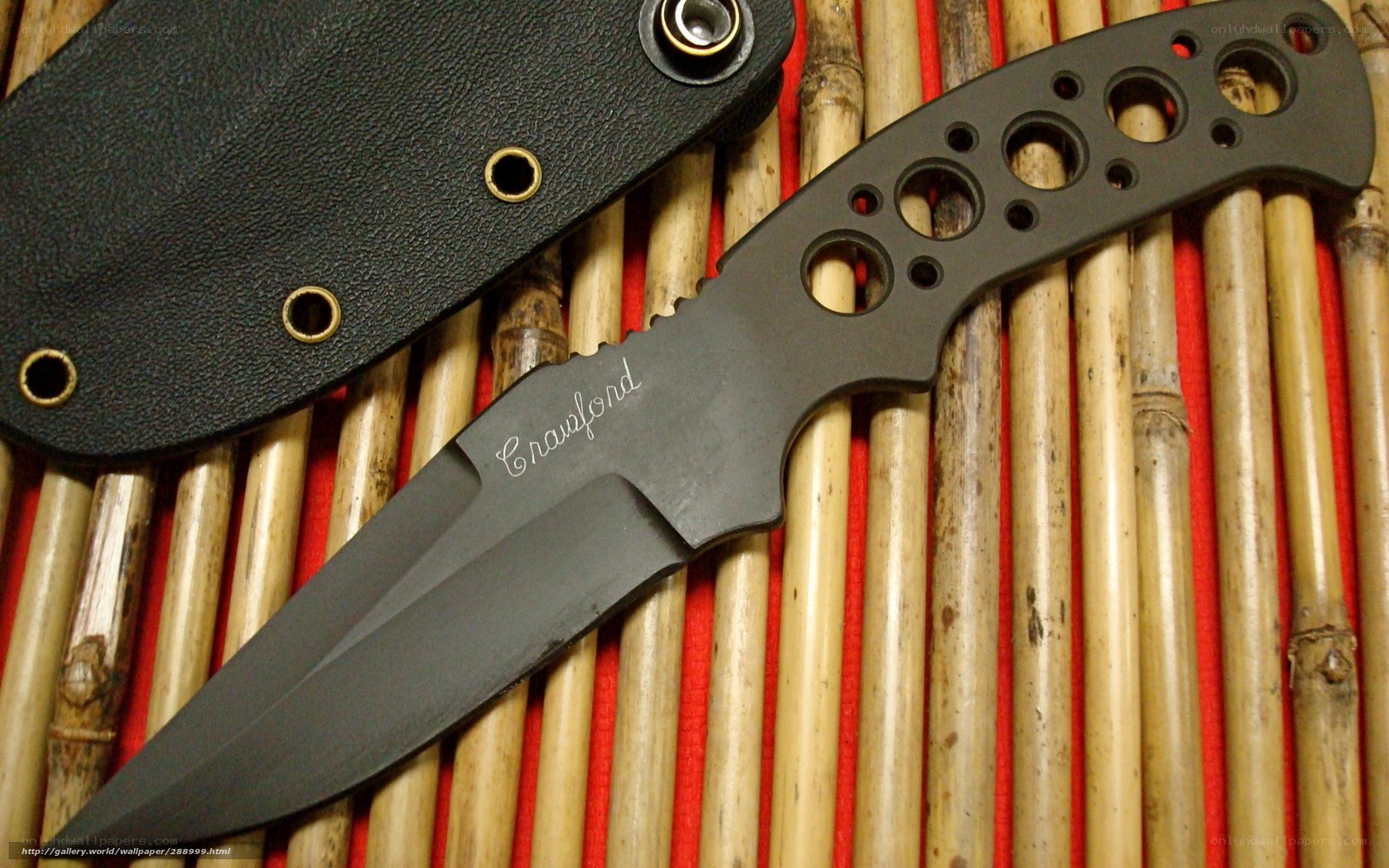 black tactical knife with sheath
