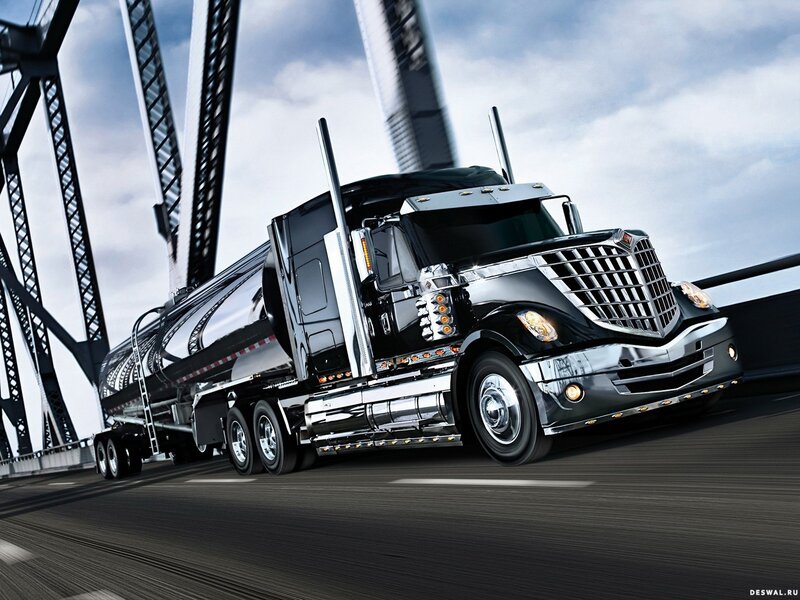 black tanker truck on bridge