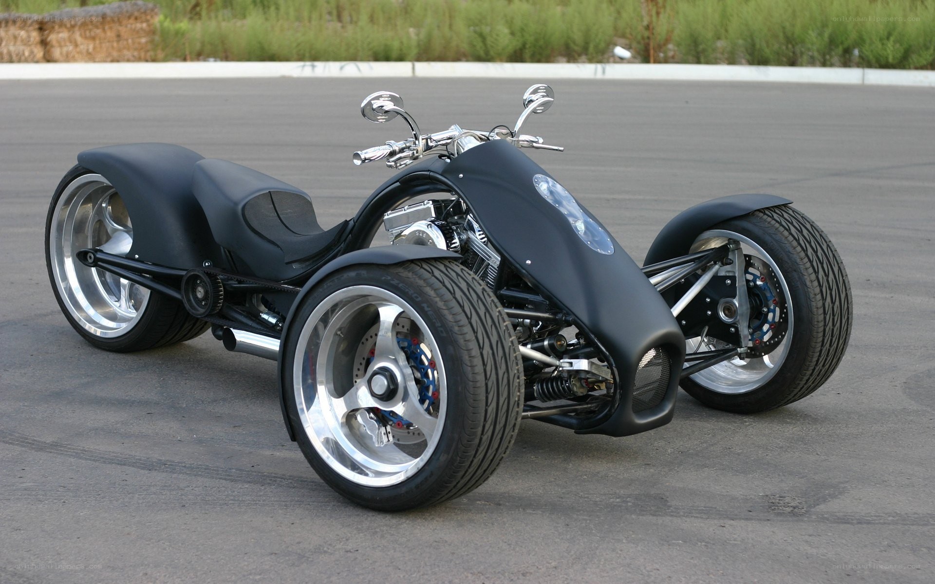Black three-wheeled custom motorcycle