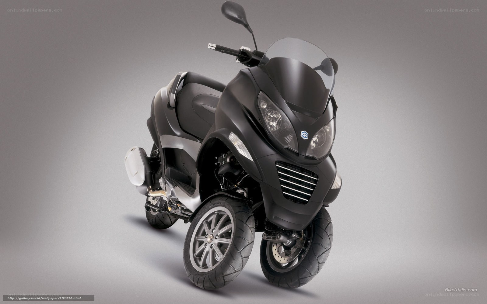 black three-wheeled scooter