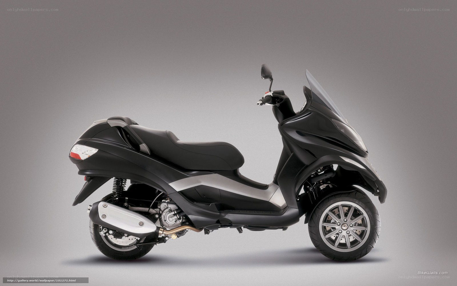 black three-wheeled scooter
