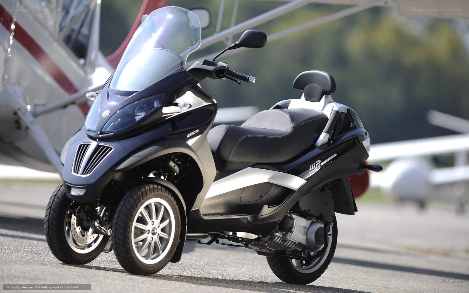 black three-wheeled scooter
