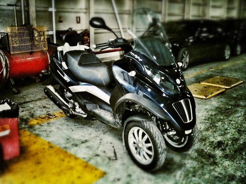 Black Three-wheeled Scooter — Industrial