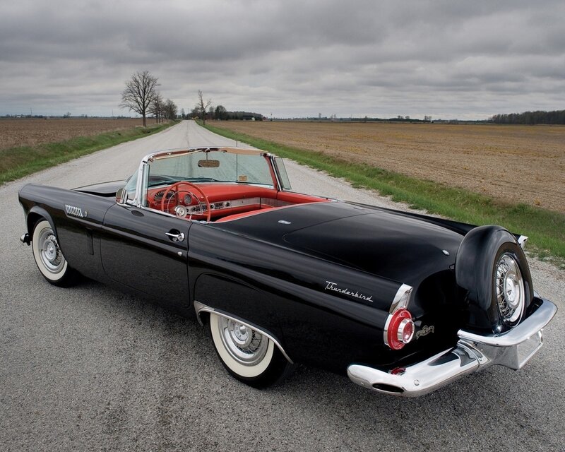 Black Thunderbird convertible on country road