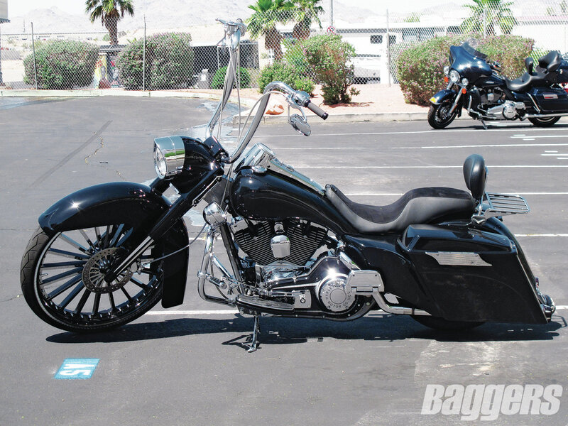 Black Touring Motorcycle — Calm, Afternoon, Photograph, Parking Lot