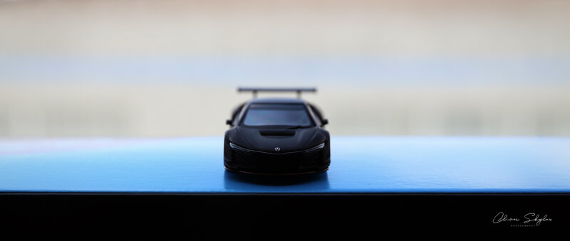 Black Toy Car Model — Minimalist, Photograph