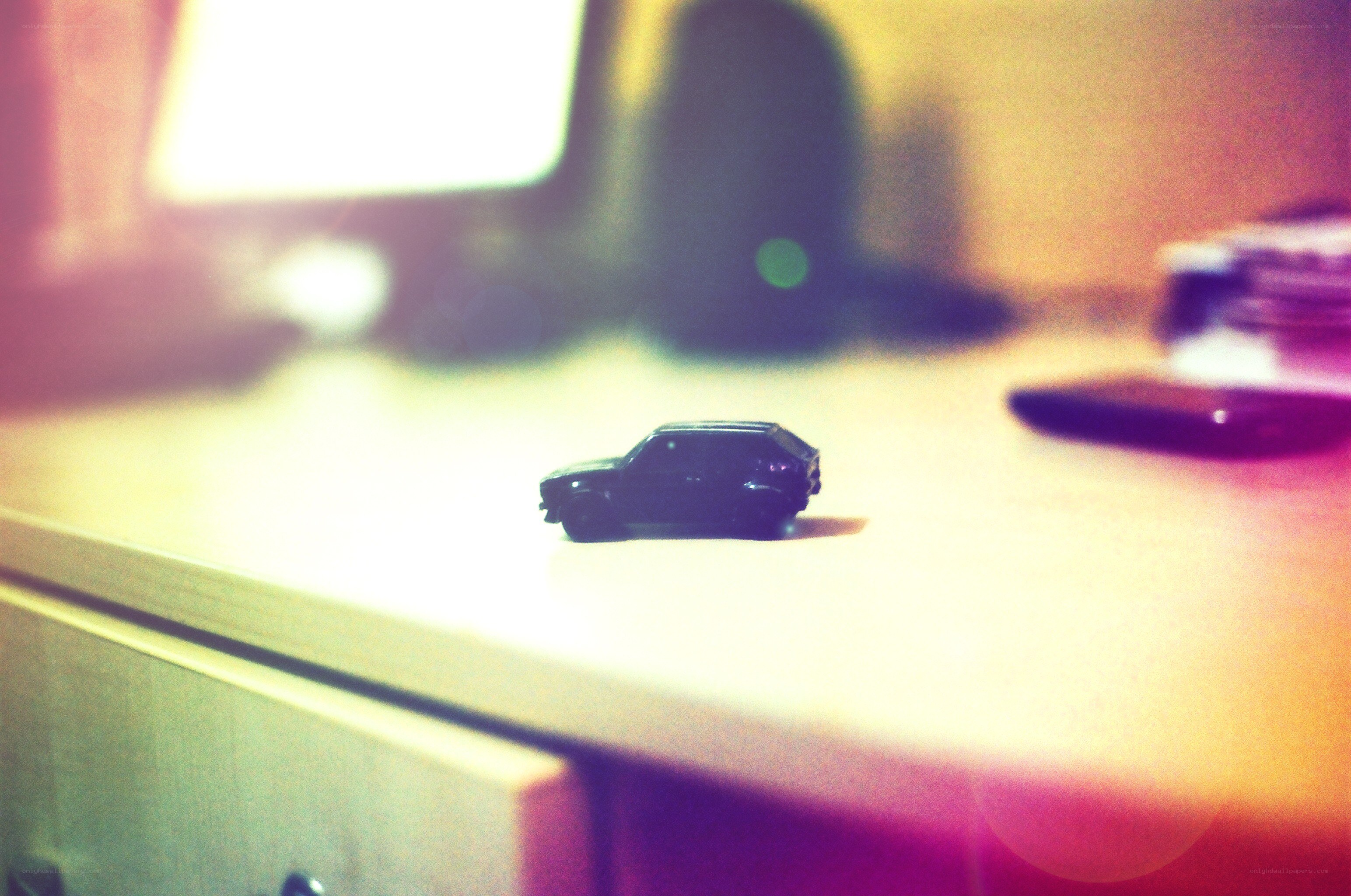 black toy car on desk