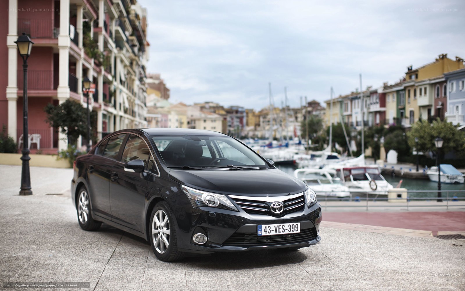 Black Toyota Avensis by the harbor