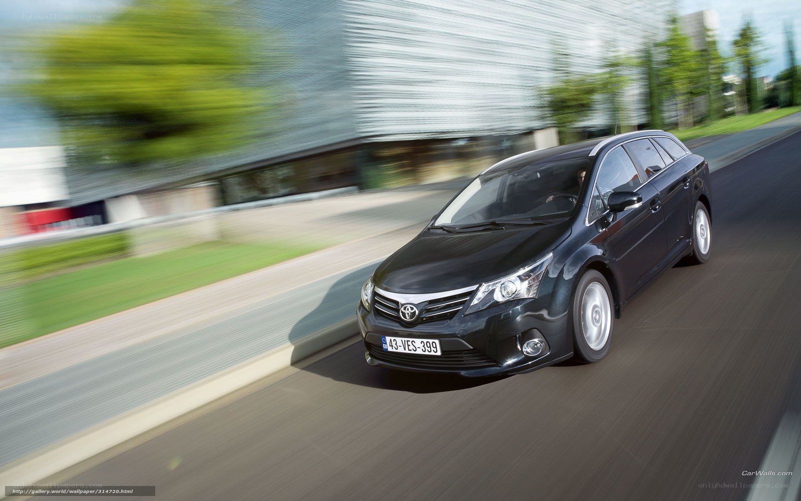 black toyota avensis in motion
