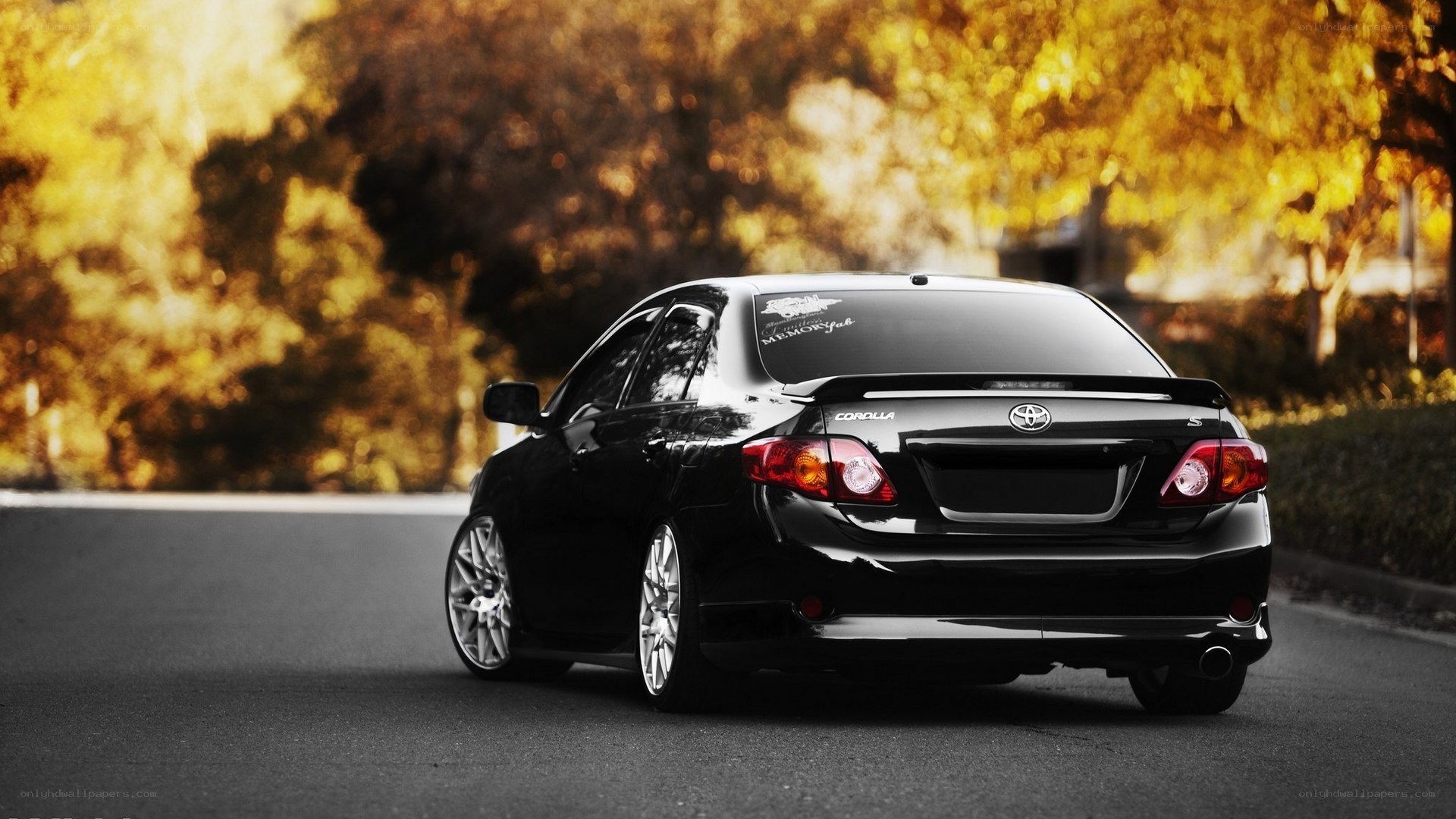 black toyota corolla on road