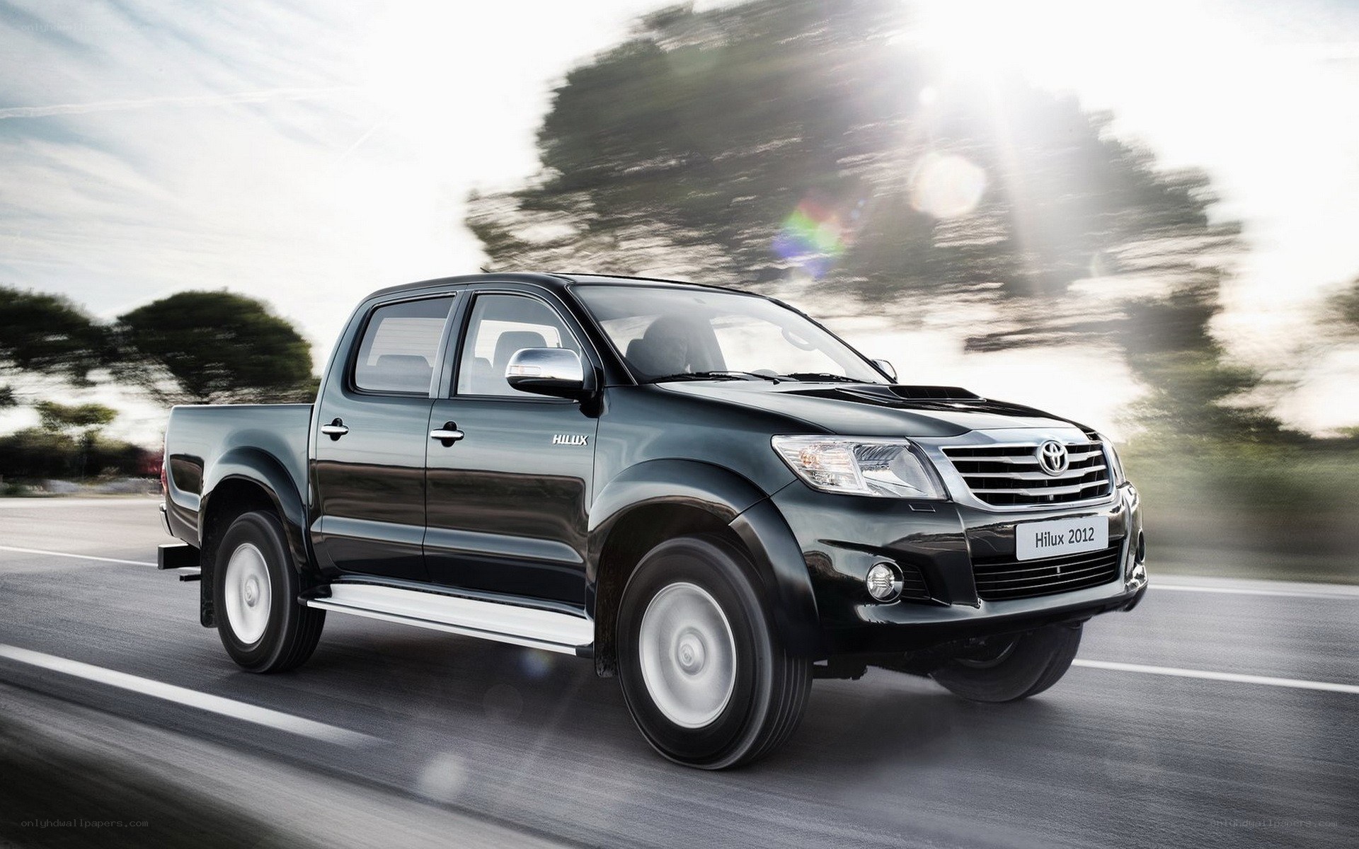 Black Toyota Hilux in motion