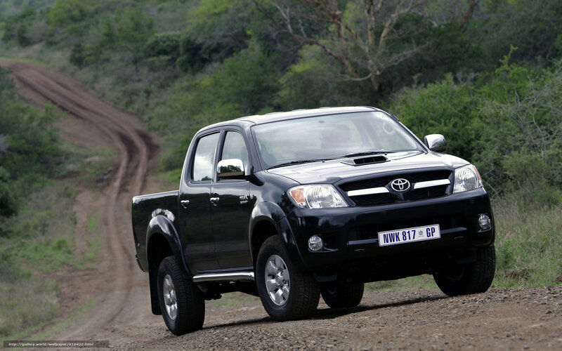 Black Toyota Hilux on dirt road