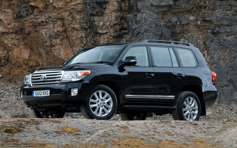 Black Toyota Land Cruiser — Dramatic, Photograph, Rock Wall