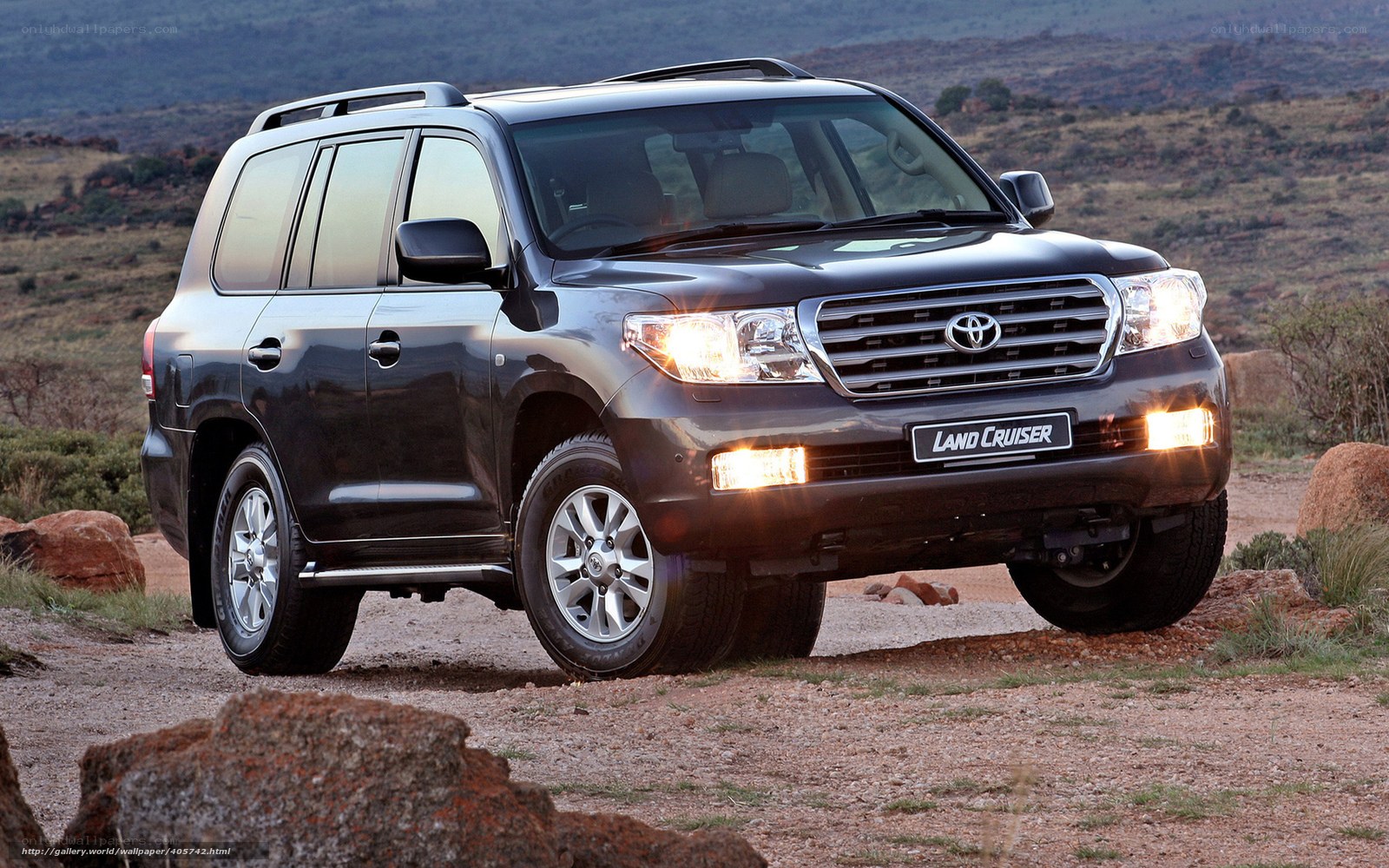 Black Toyota Land Cruiser on dirt road