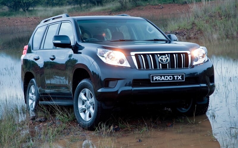 Black Toyota Prado in water