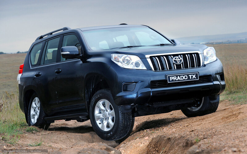 Black Toyota Prado on dirt road