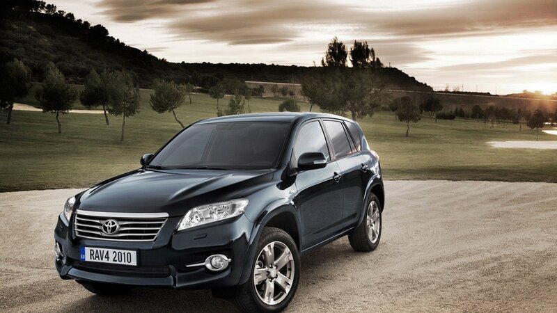 Black Toyota RAV4 on a golf course