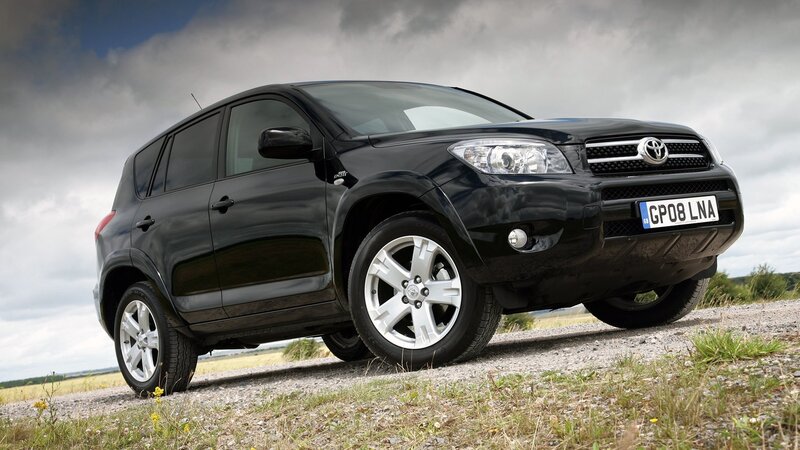 Black Toyota RAV4 on gravel