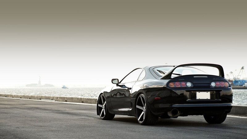 Black Toyota Supra by the water