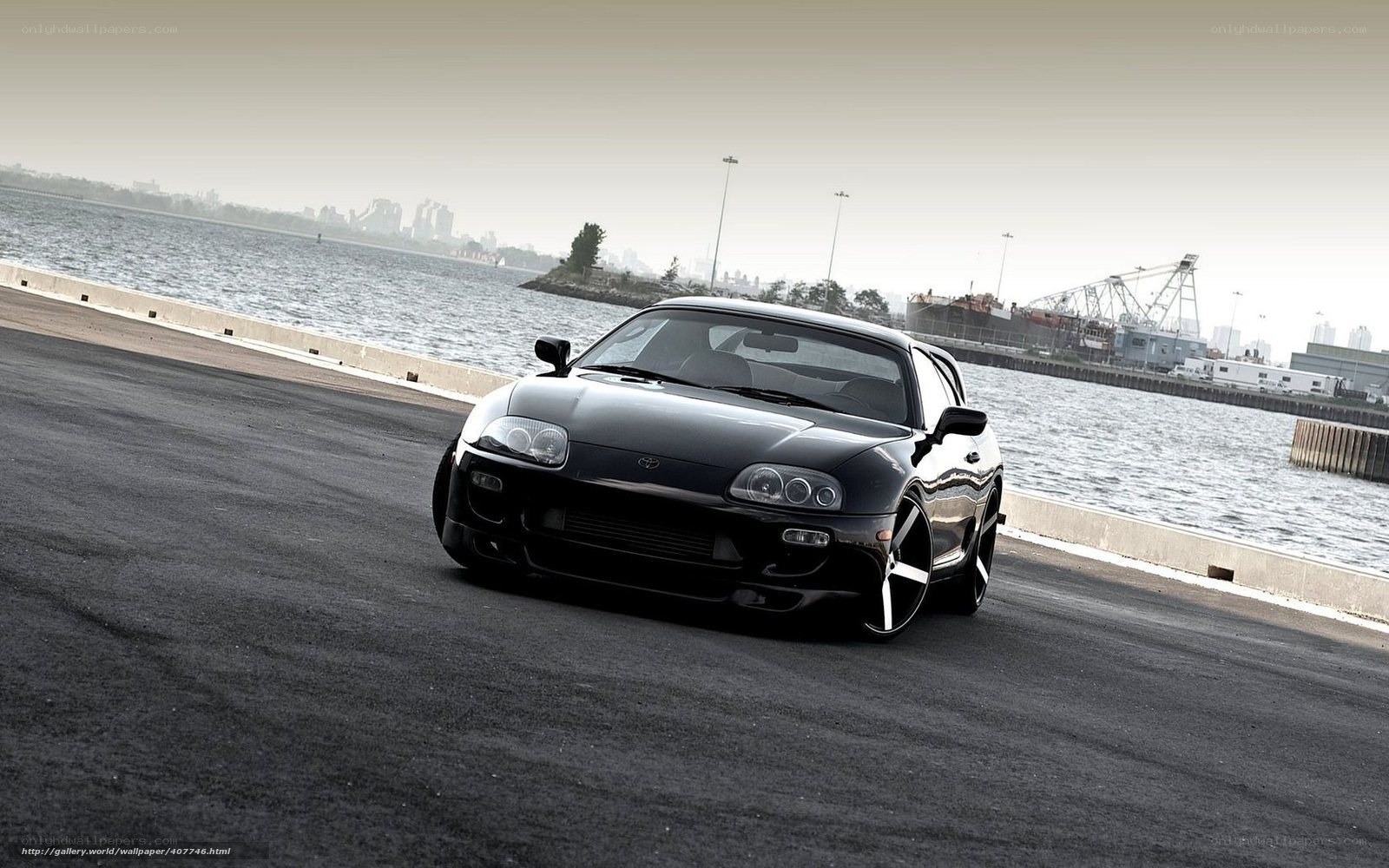Black Toyota Supra by the water