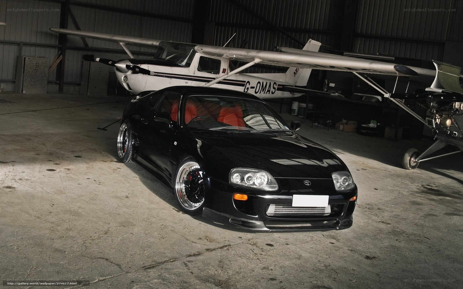 Black Toyota Supra in hangar