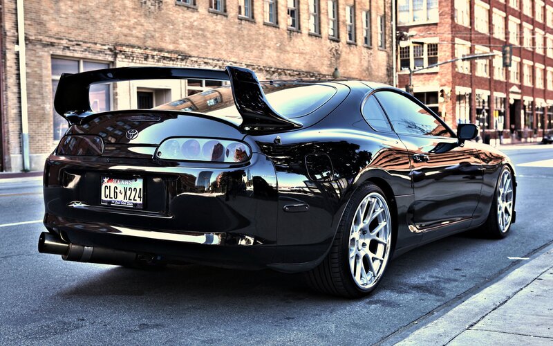 Black Toyota Supra on city street