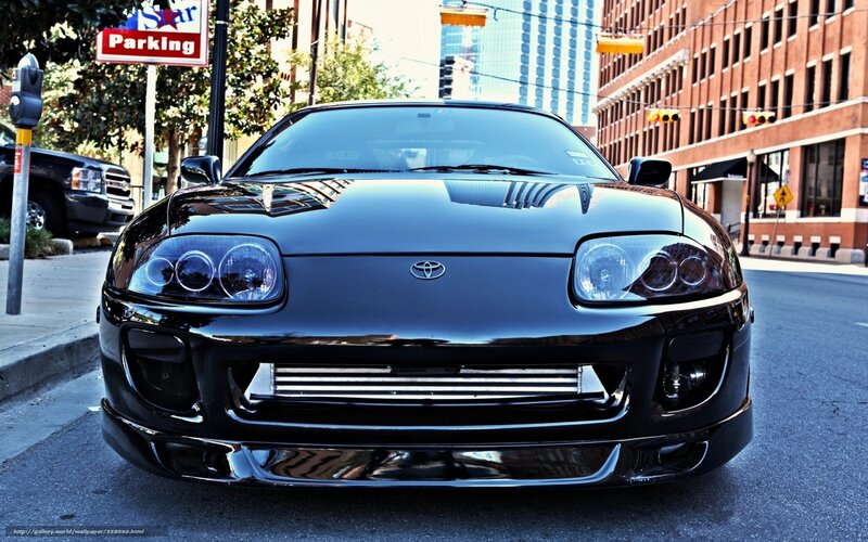 Black Toyota Supra on city street