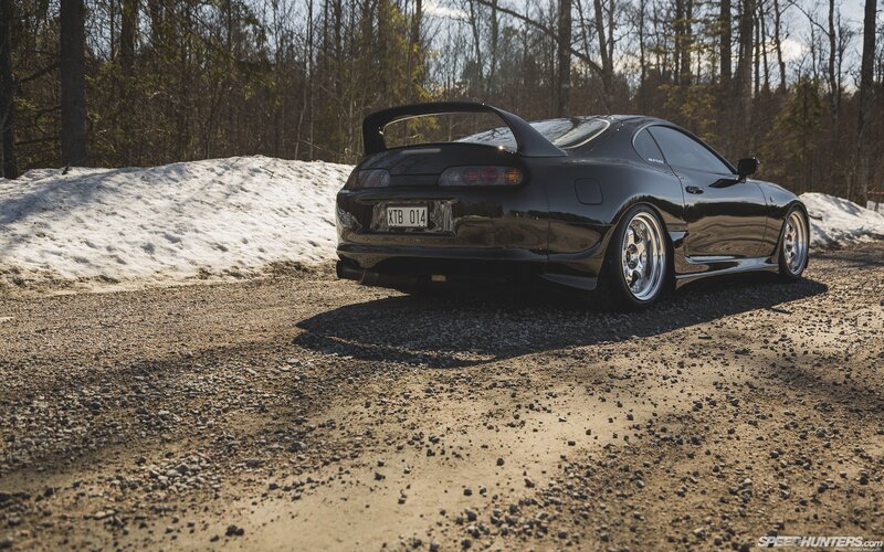 black toyota supra on gravel