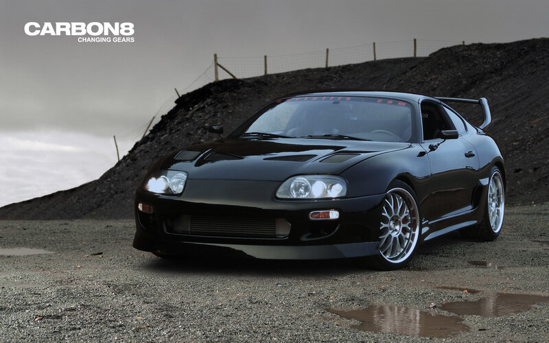 Black Toyota Supra on gravel