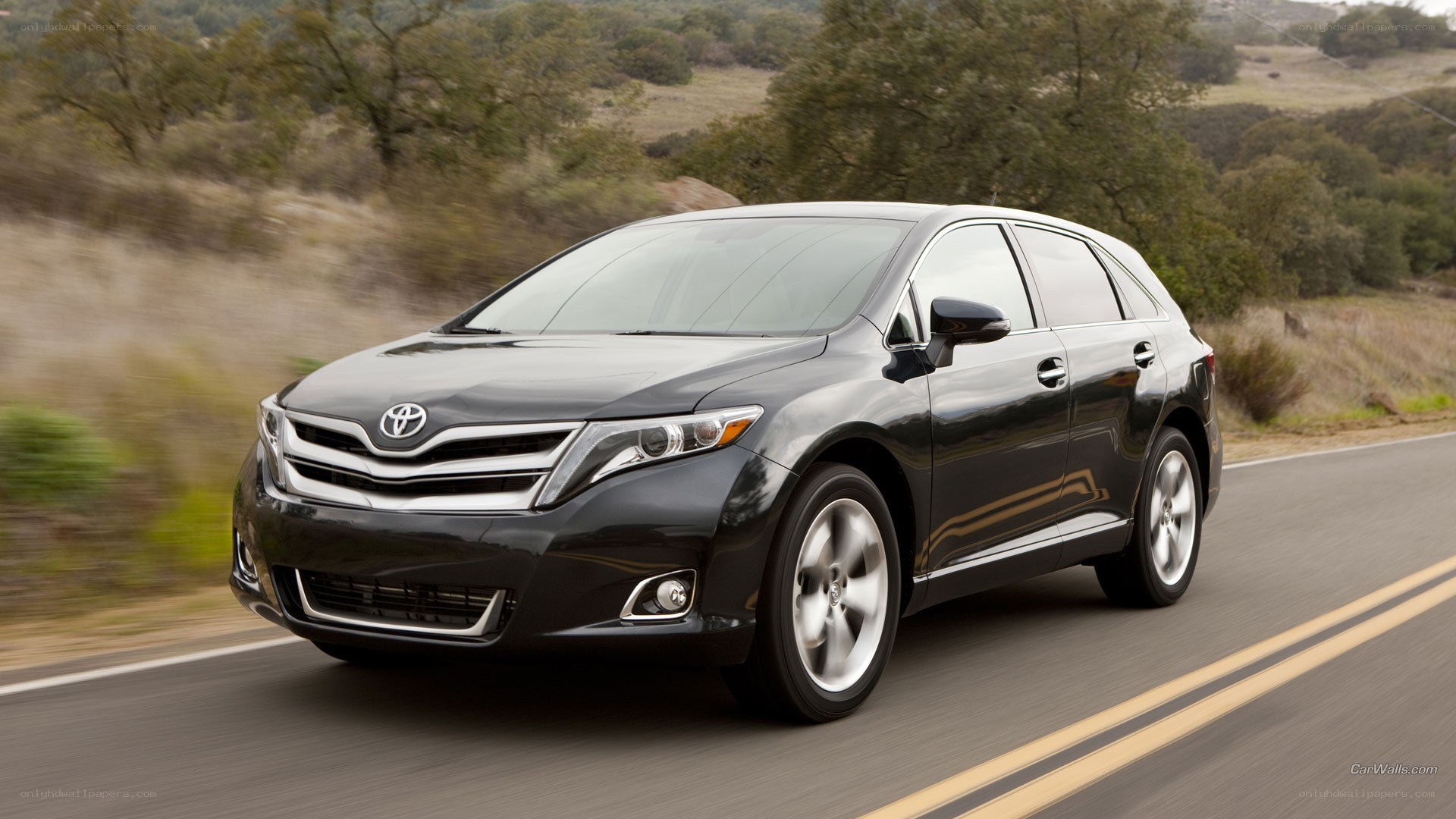 black toyota venza driving