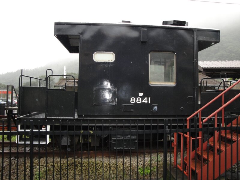 Black train caboose on display
