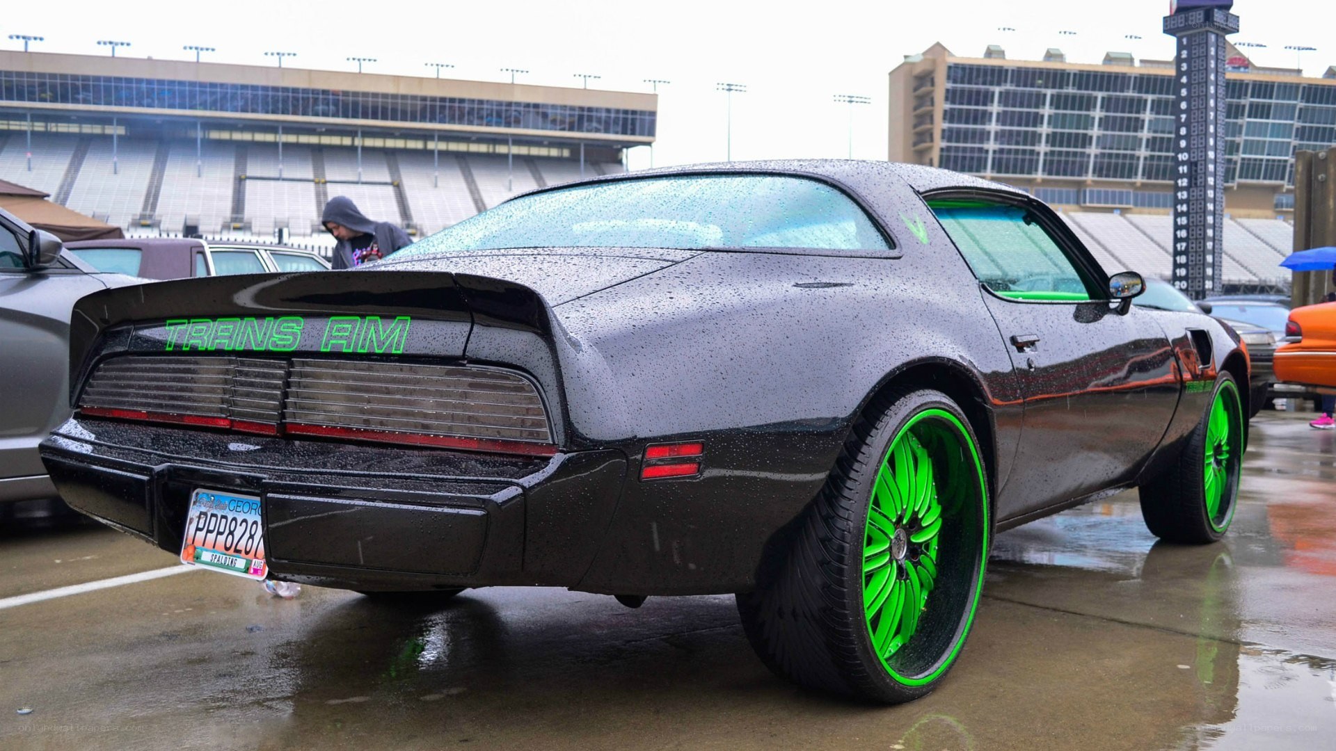 Black Trans Am with green wheels