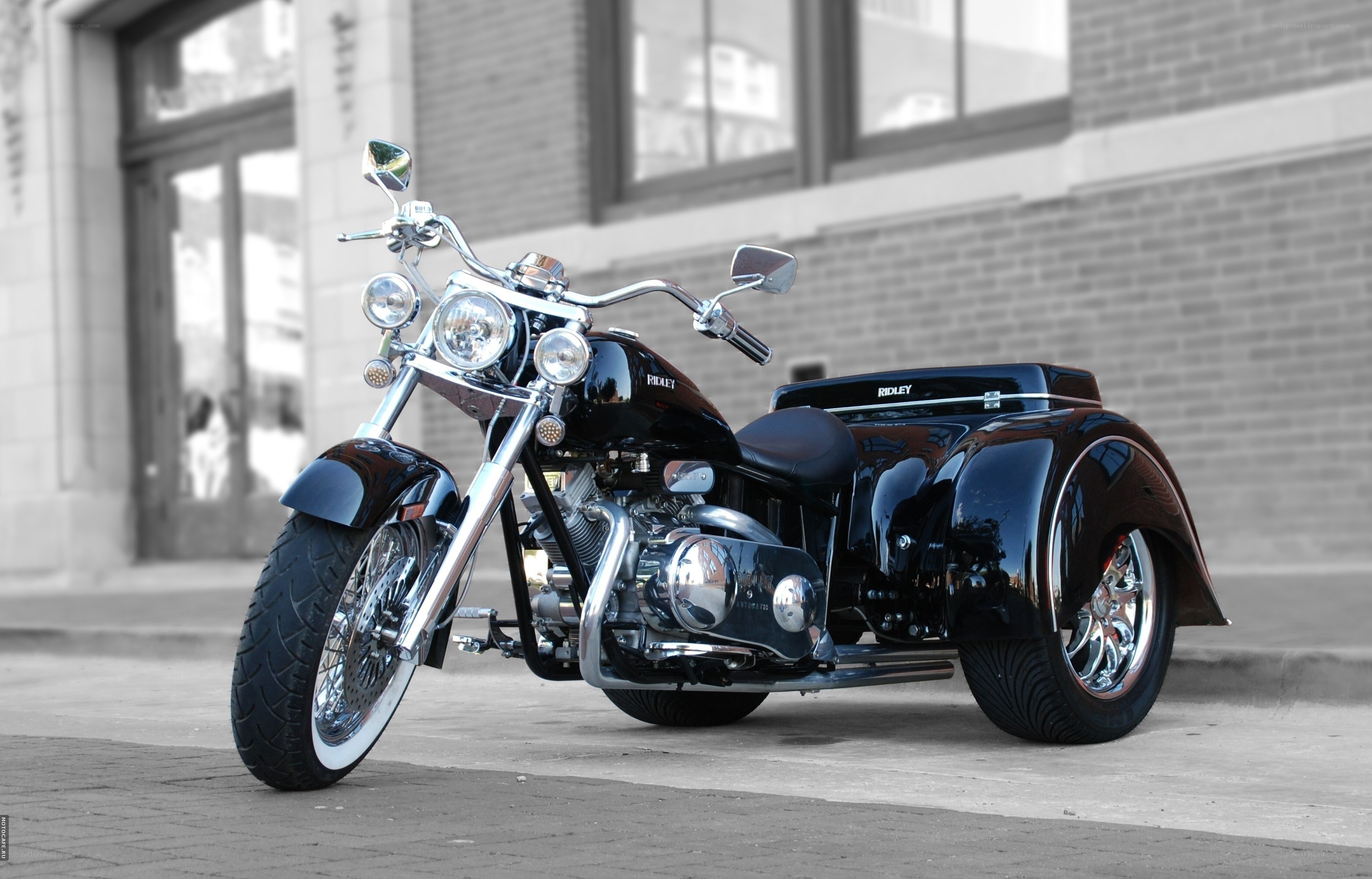 Black tricycle motorcycle on street