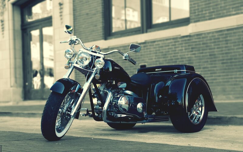 Black trike motorcycle on street