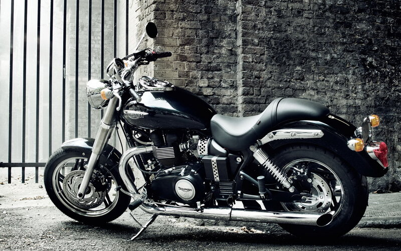 Black Triumph Motorcycle — Dramatic, Photograph, Brick Wall