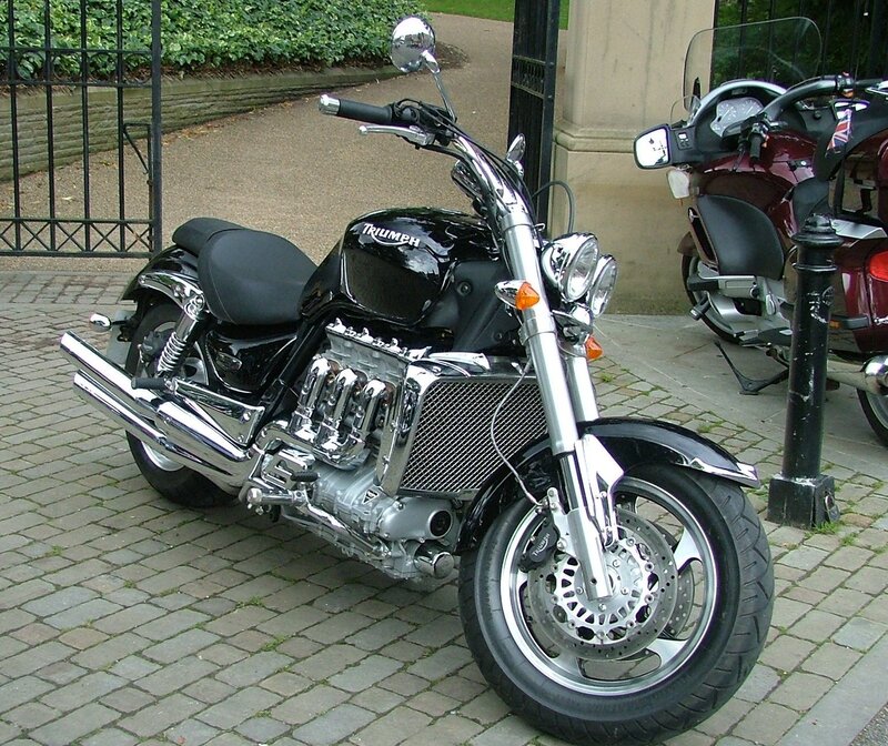 Black Triumph motorcycle on pavement