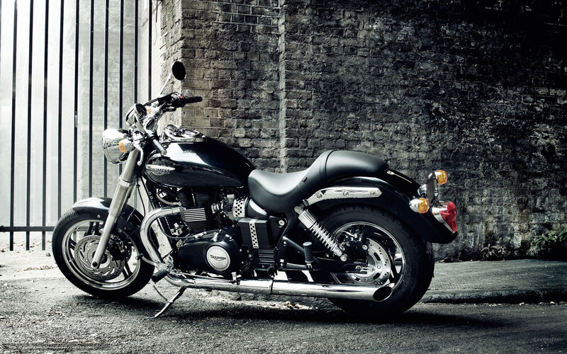 Black Triumph motorcycle on street