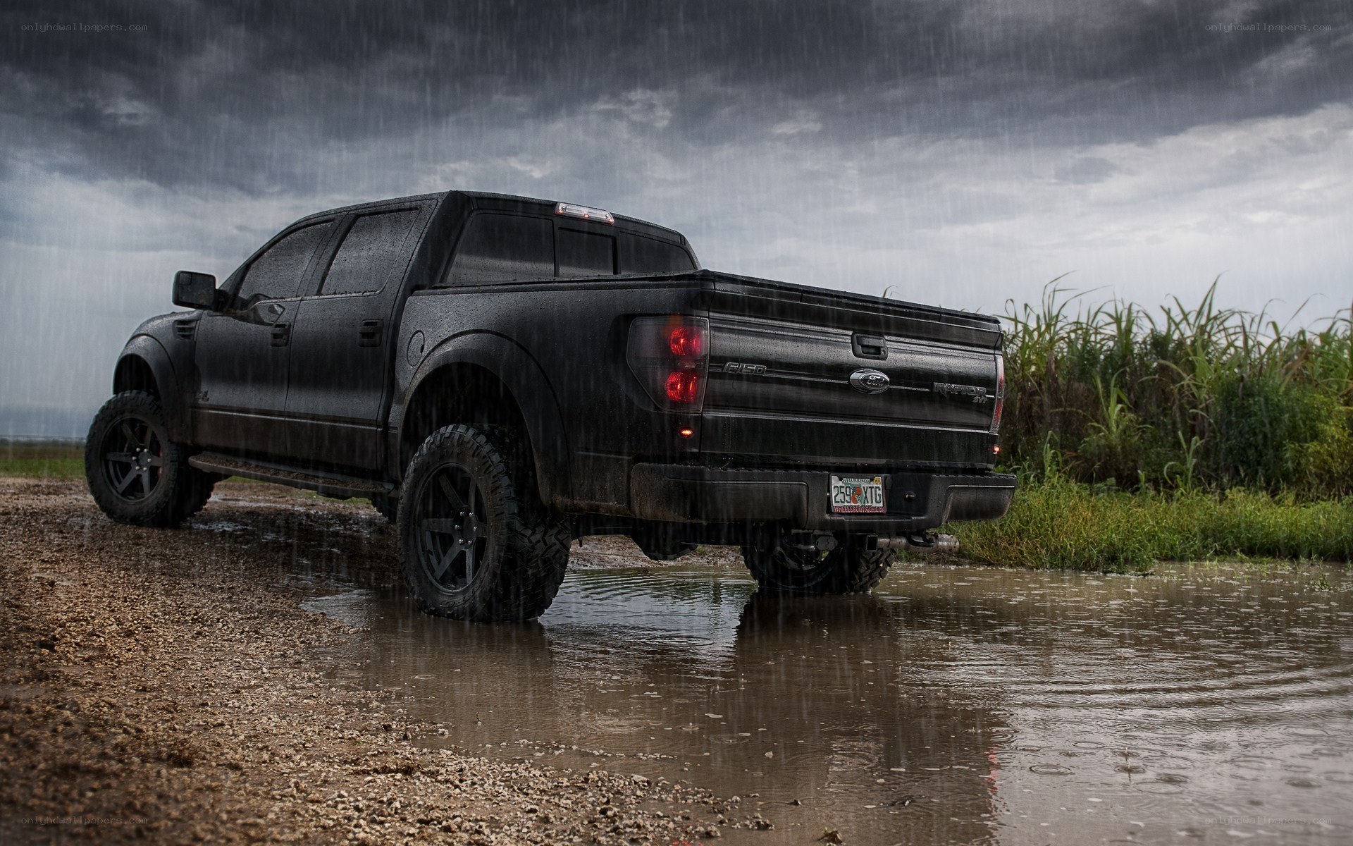 black truck in rainstorm